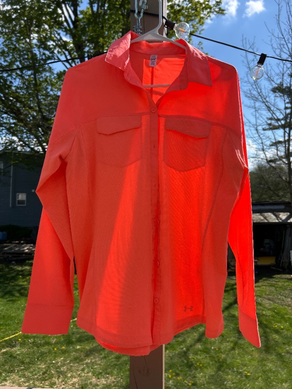 Under Armour Women's Tide Chaser Hybrid long-sleeve button-up neon orange color